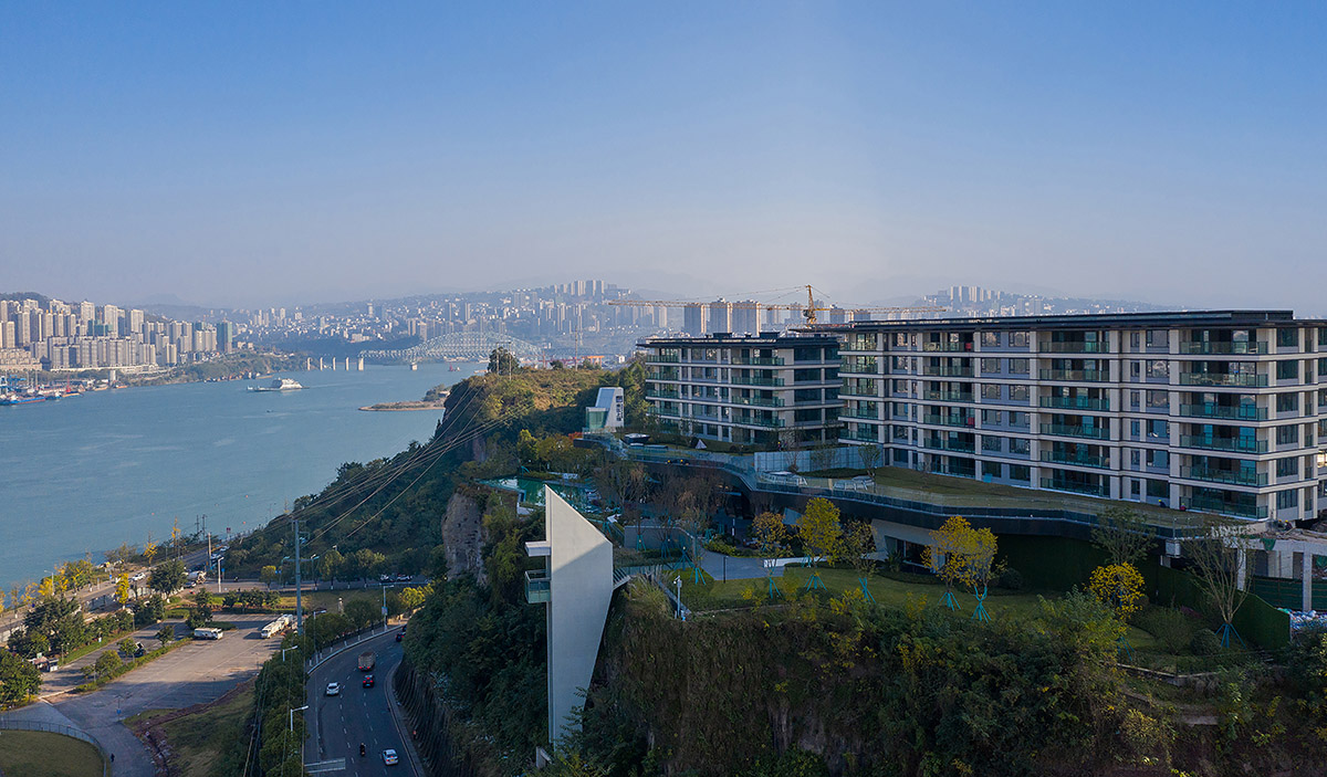 aoe completes reception center with glass polyhedron with observation tower on the edge of cliff