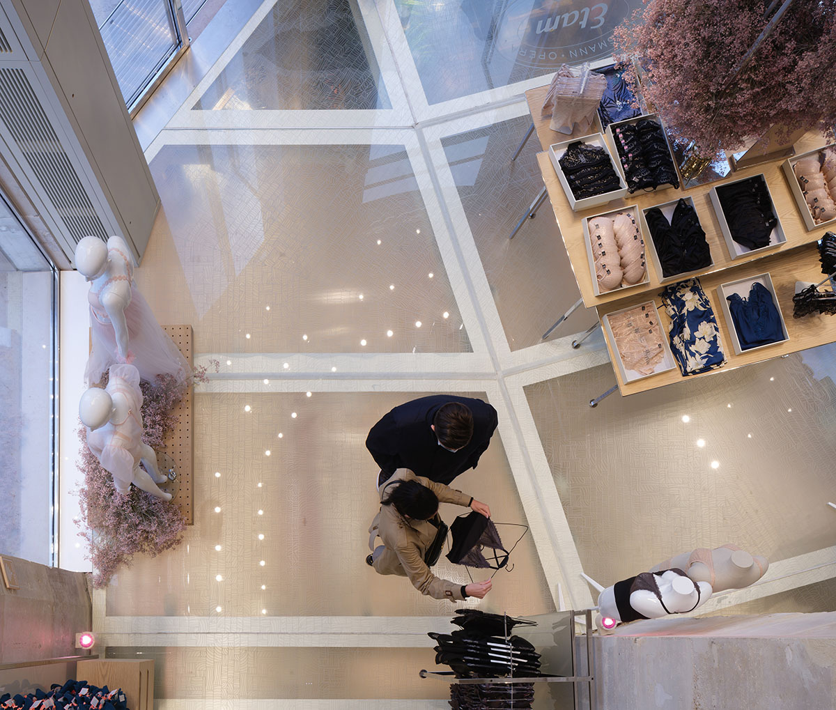 MVRDV renovates 19th-century Haussmann building with glass floor for a lingerie store in Paris