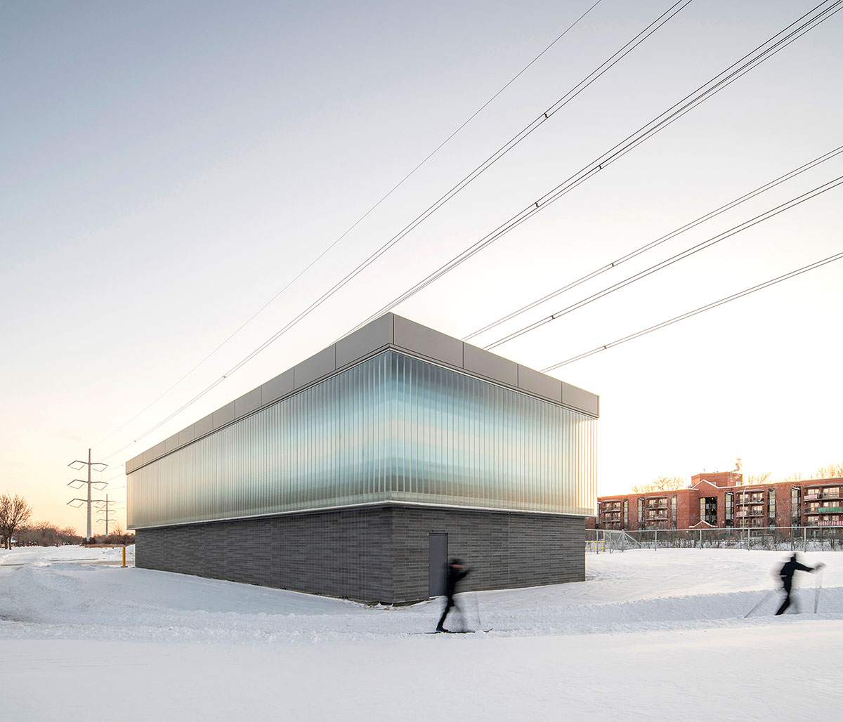 Smith Vigeant architectes designs water intake building clad in glass cube and shimmering pixels