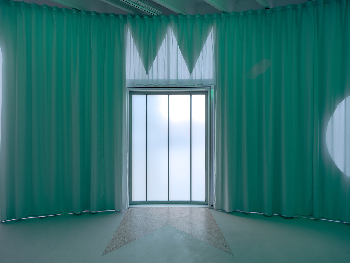 Studio Ossidiana combines three tangential rings to create pinkish floating art pavilion in Almere