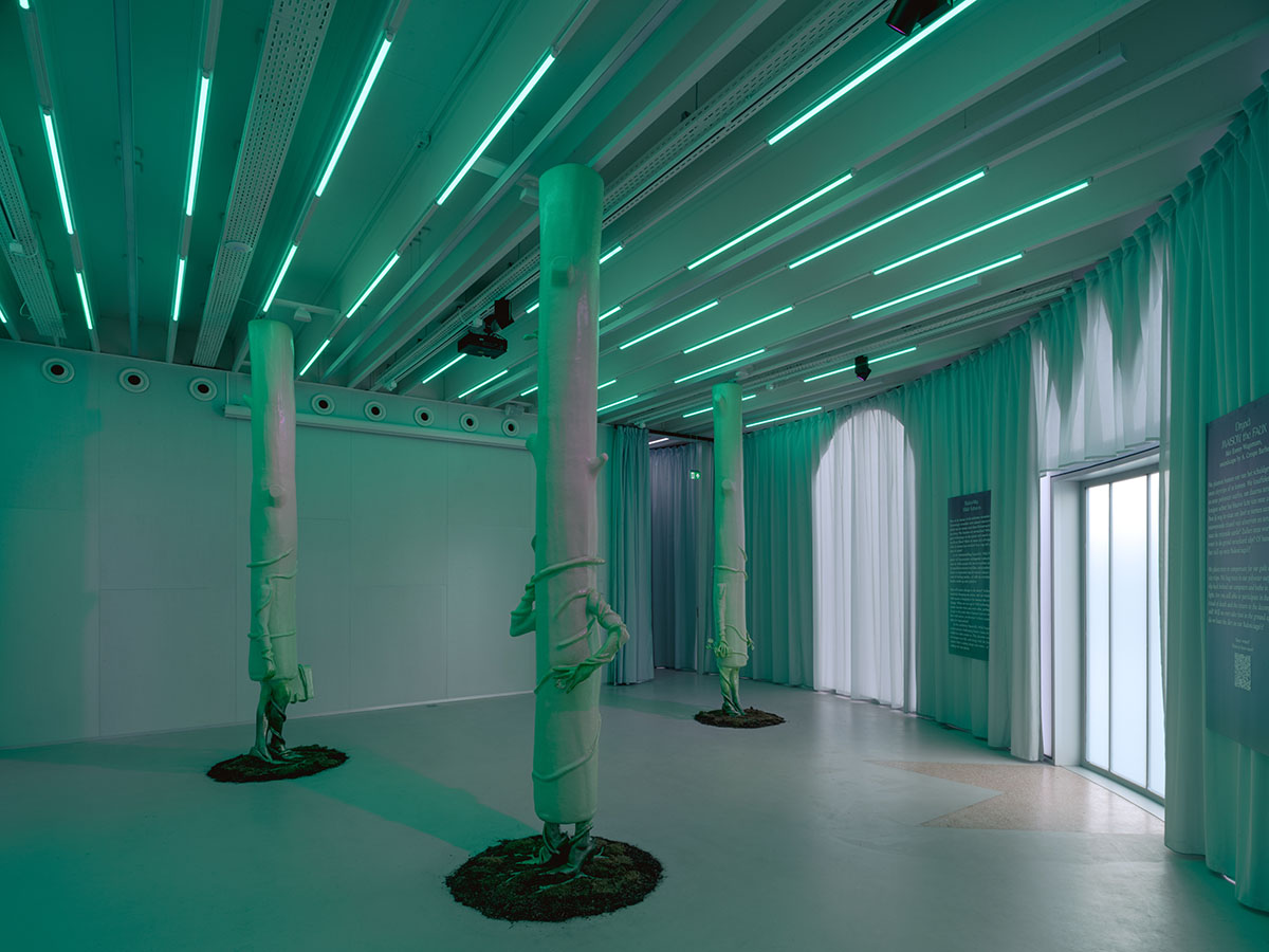 Studio Ossidiana combines three tangential rings to create pinkish floating art pavilion in Almere