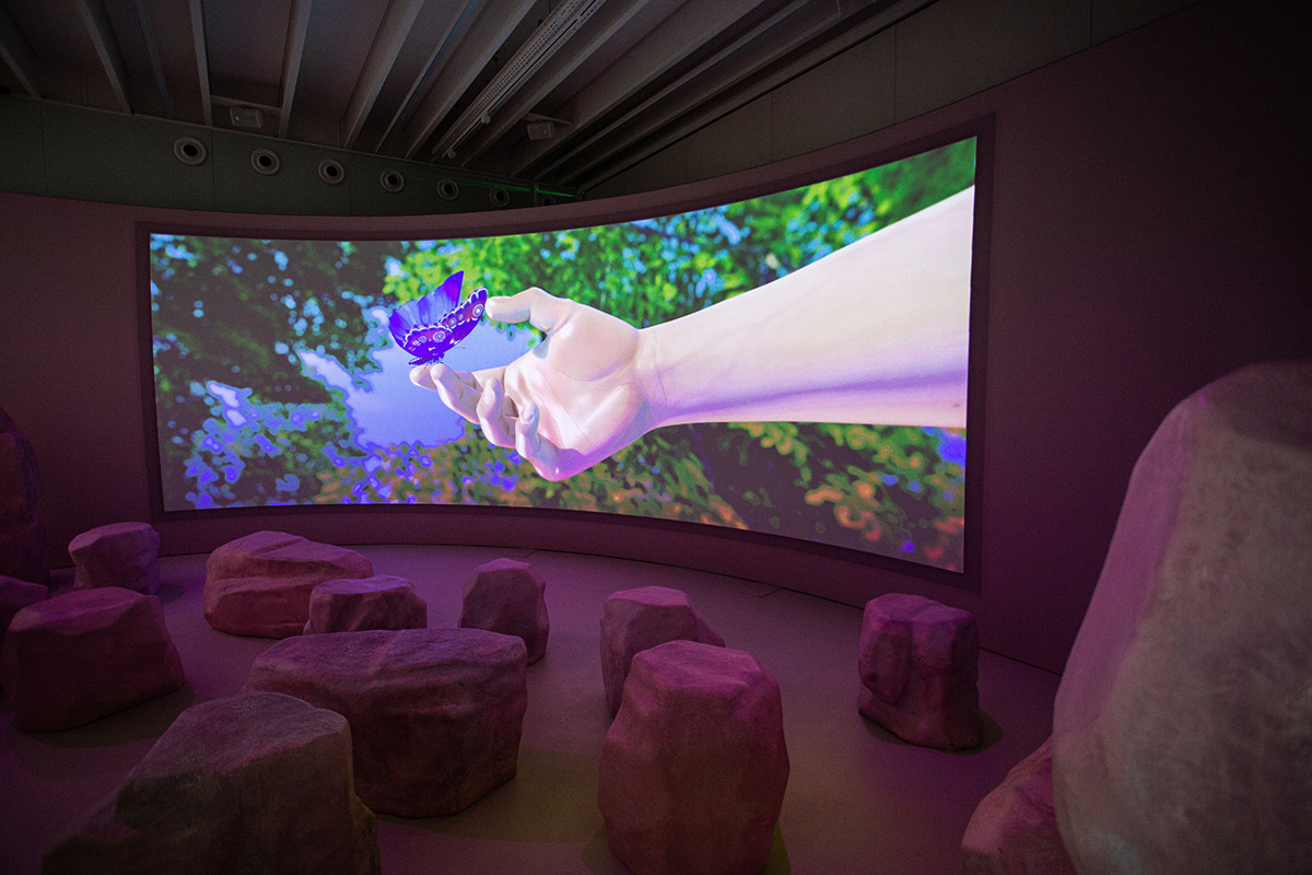 Studio Ossidiana combines three tangential rings to create pinkish floating art pavilion in Almere