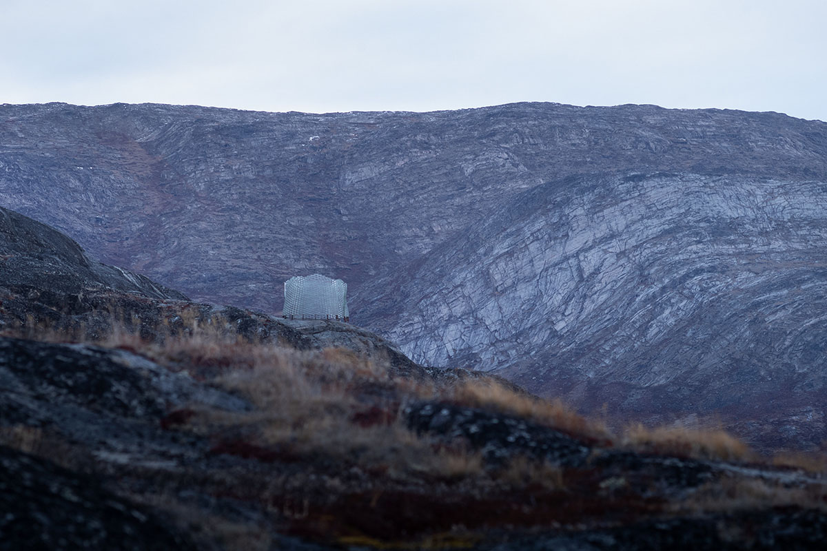 Circular Qaammat Pavilion is made of glass blocks to activate snow reflections in Greenland