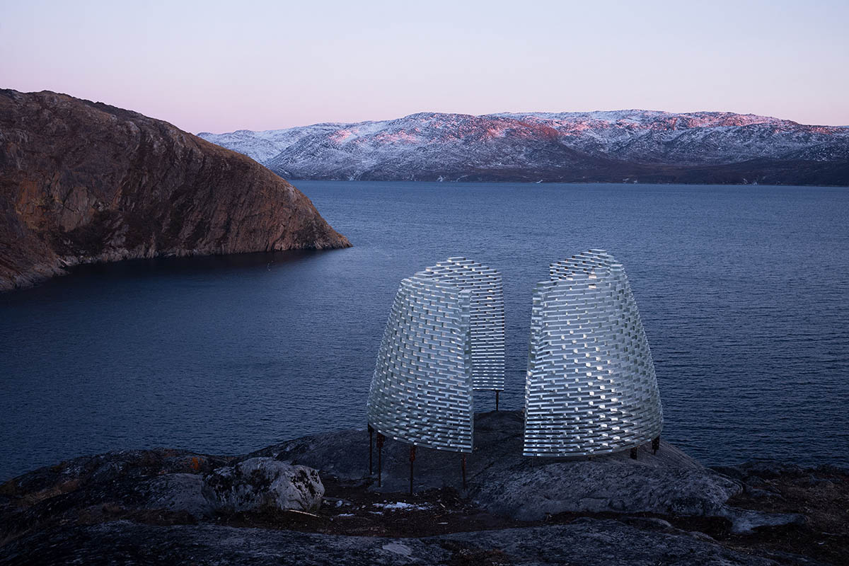 Circular Qaammat Pavilion is made of glass blocks to activate snow reflections in Greenland