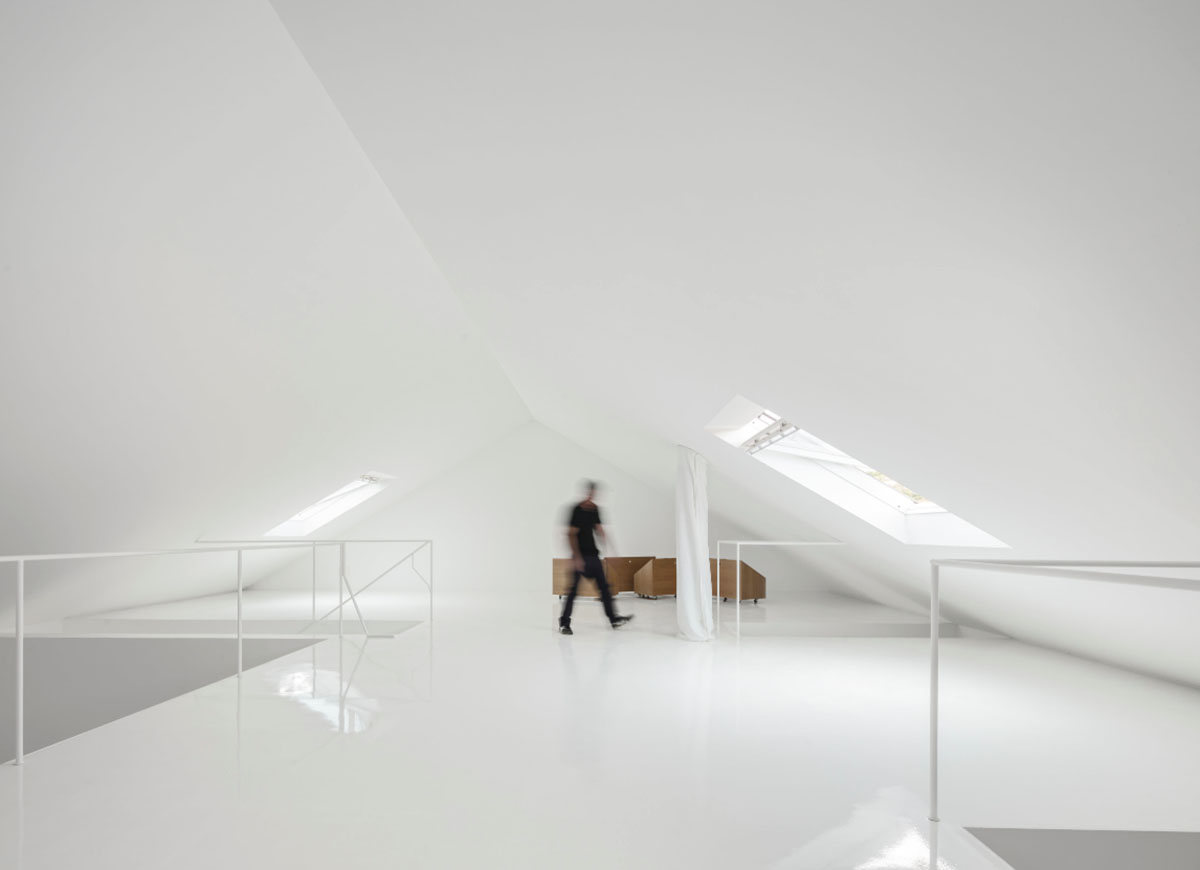 Extrastudio converted former winery in Portugal  into a new family home with red mortar walls