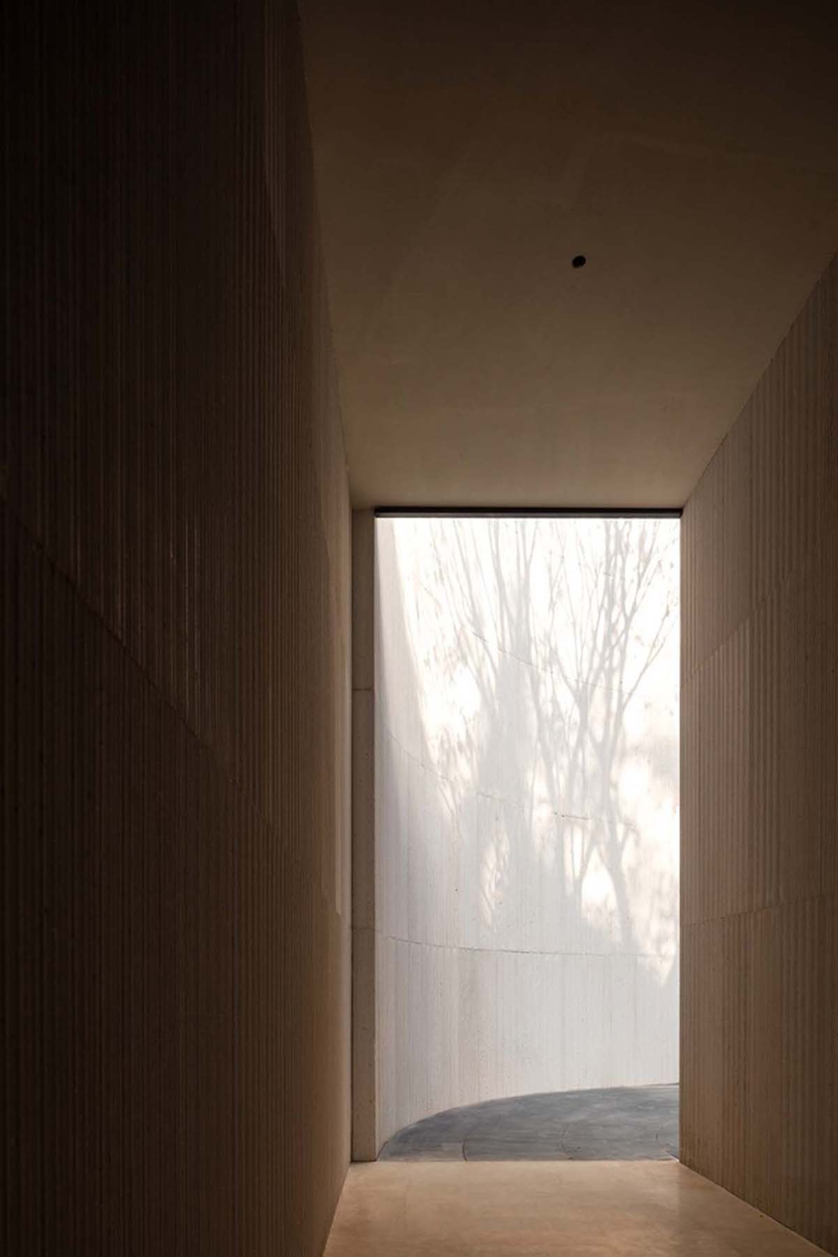 Waterfrom Design creates peaceful interior with wooden furnitures for tea community center in China