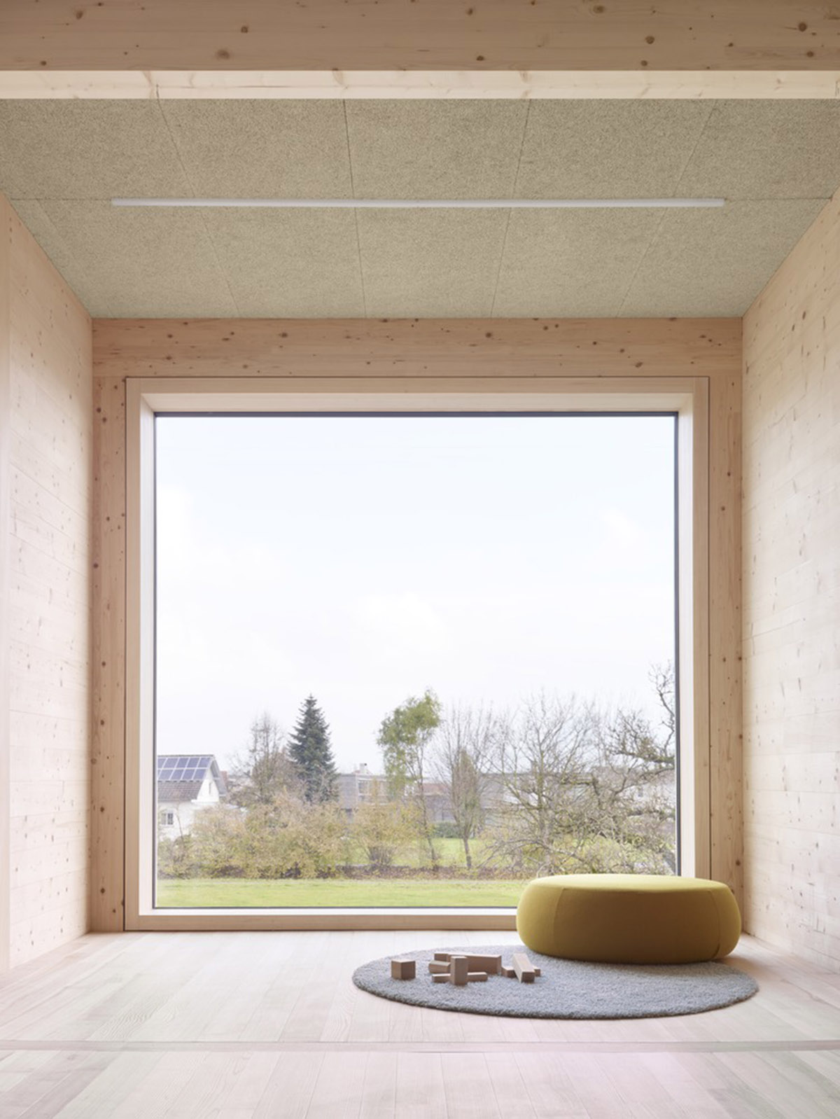 Innauer-Matt Architekten designs kindergarten with large pointed windows and wall motifs in Austria