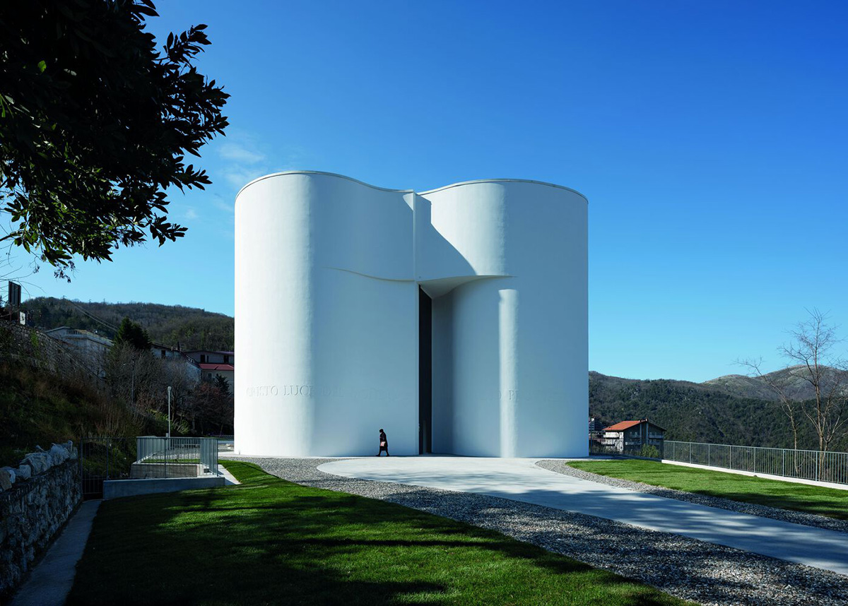 Smooth all-white walls form church designed by Mario Cucinella Architects in Mormanno hill town 