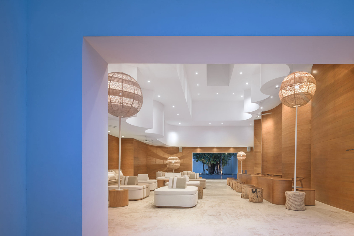 onion combines white concave and convex walls with colorful surfaces for beach resort in Thailand