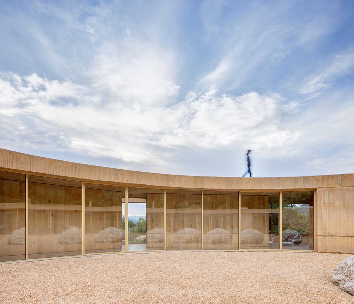 Fernanda Canales creates a circular home framing a mountain and a volcano in Mexico