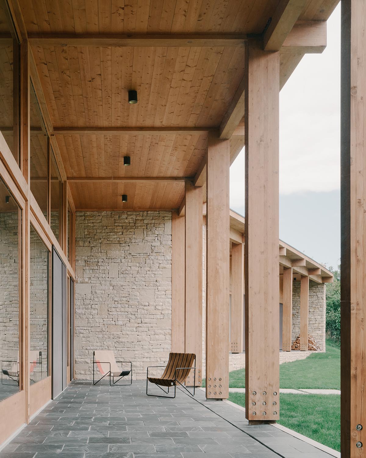 The stone and wood Tbilisi residence integrates architecture with the natural landscape