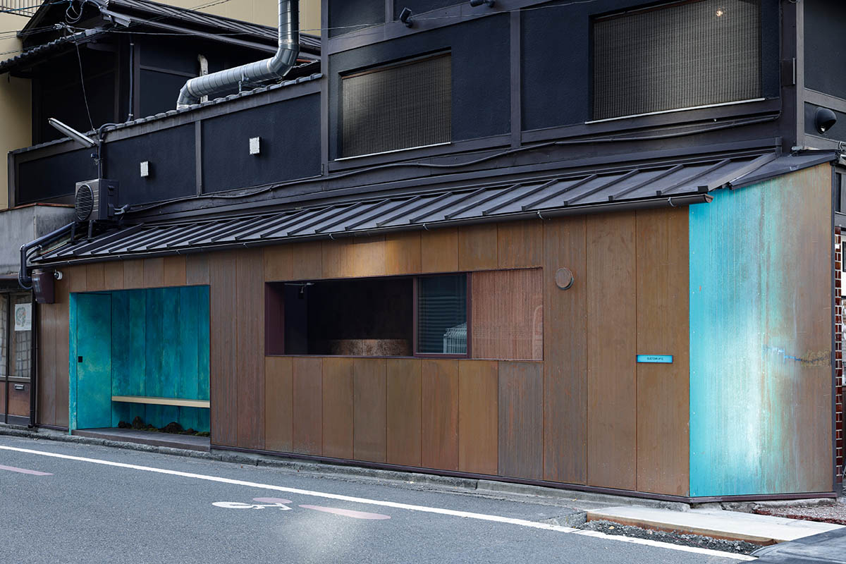The one-meter-deep cafe invites customers with its patina color on its facade in Kyoto