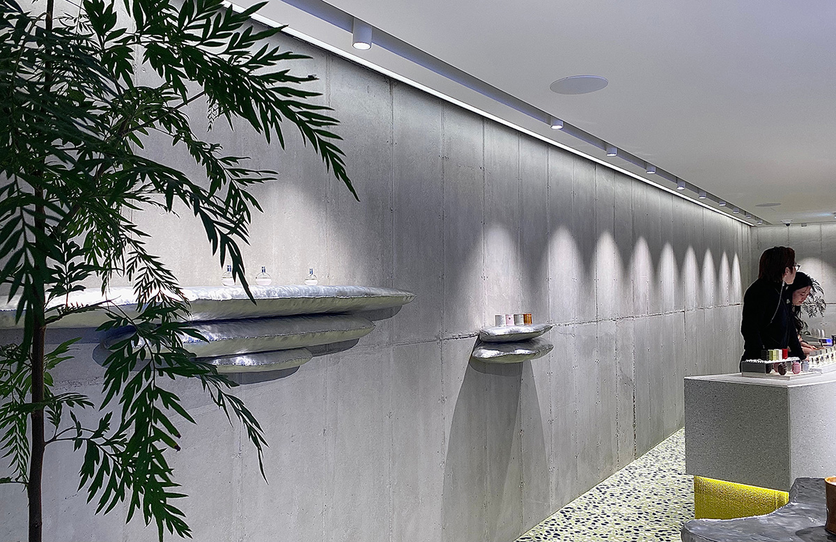 Perfume store by The System Lab shows the beauty of scent with gridded concrete and glass box