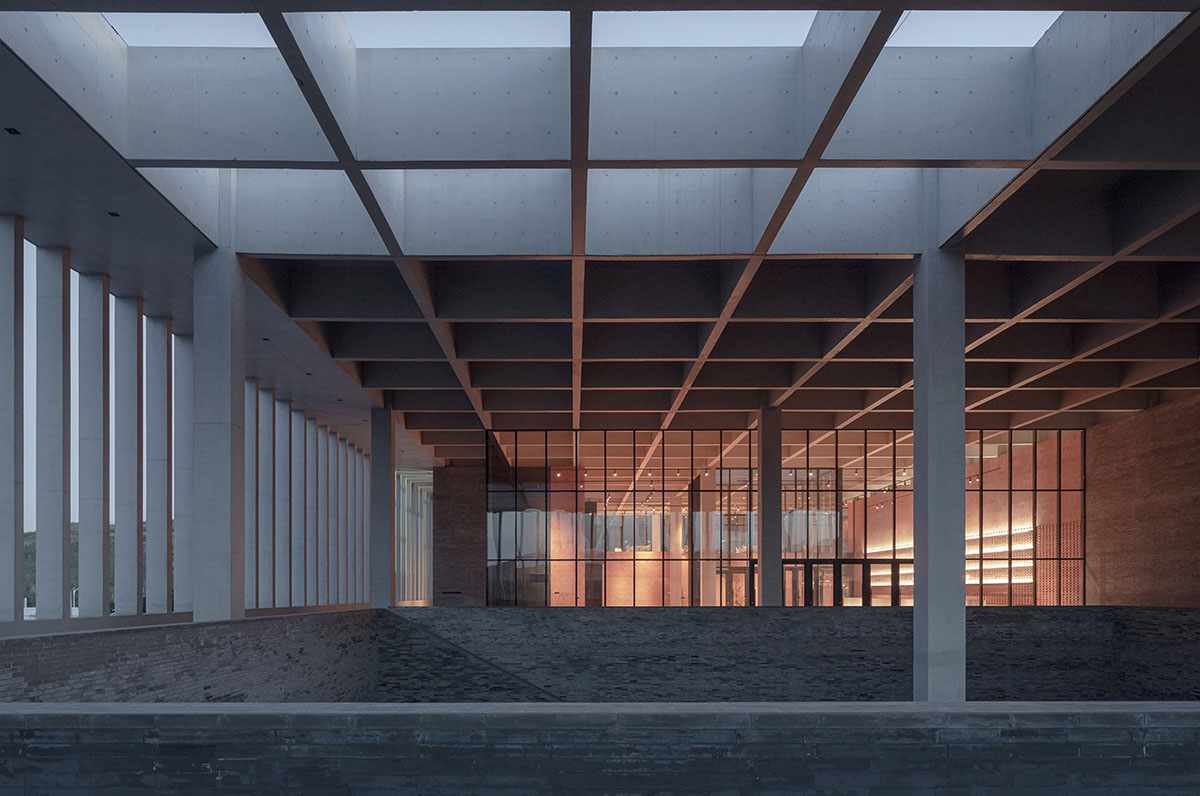 Grey brick walls wrap a factory building referencing to local construction methods in China 