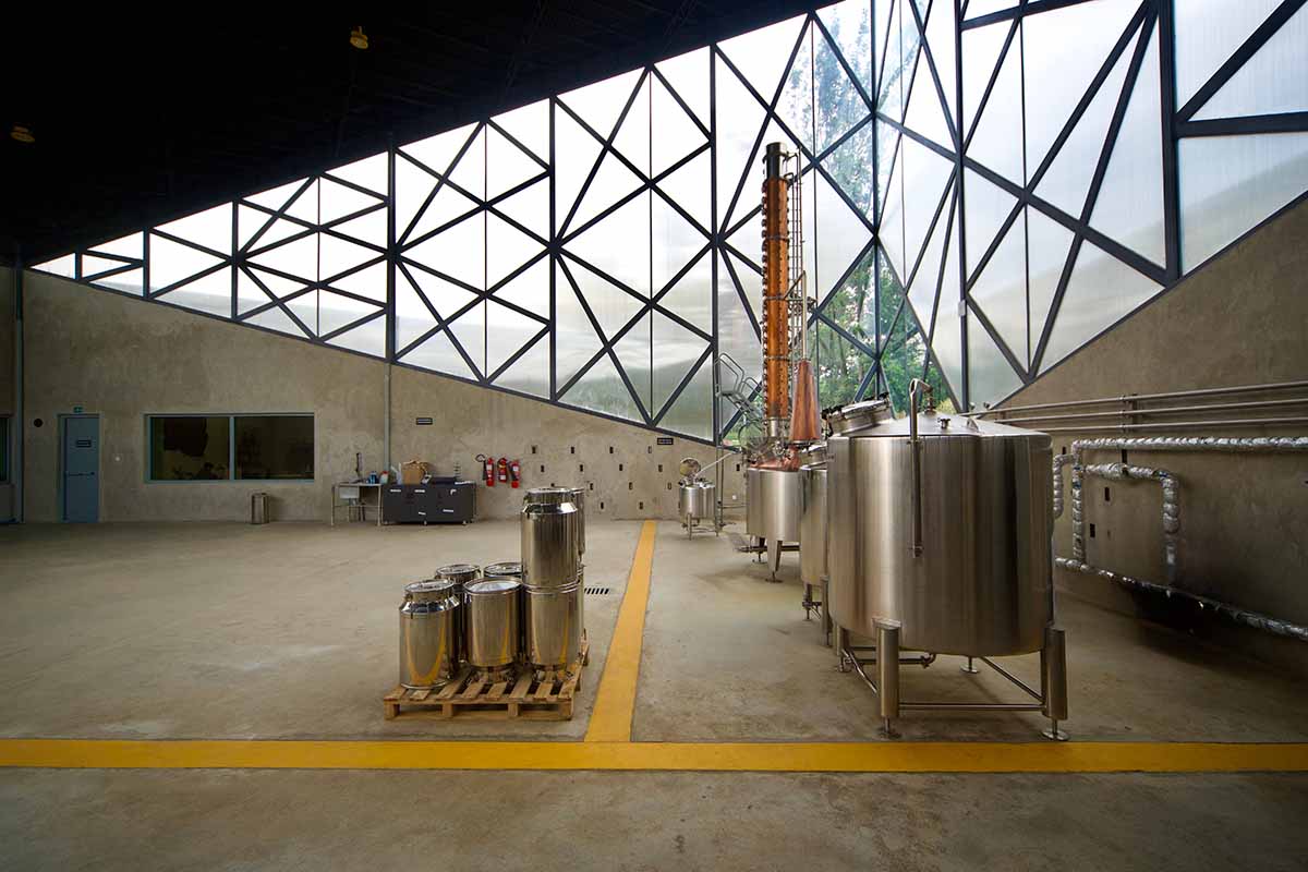 Striking geometric glass geometry resembles an open eye at a distillery in Rwanda