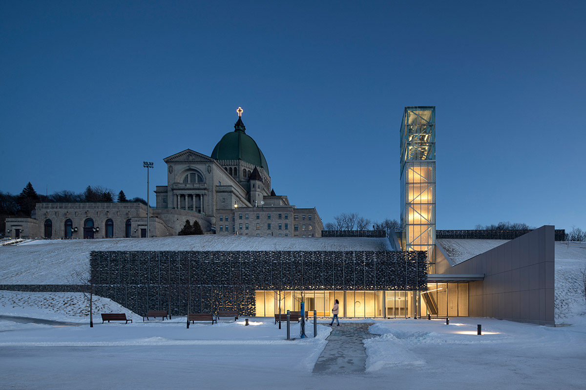 A striking bell tower pierces the sky, illuminating the grandeur of the pavilion in Montreal