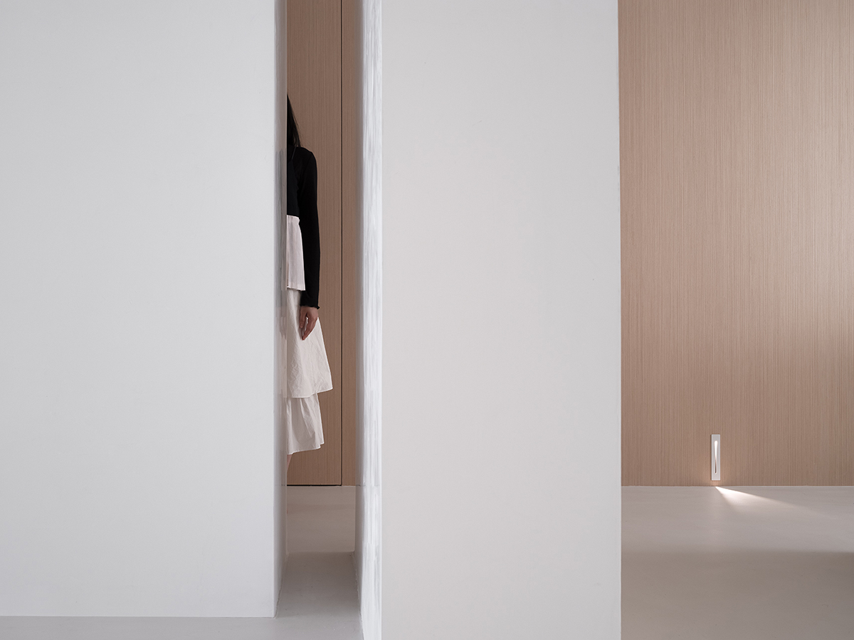 AD ARCHITECTURE creates all-white interiors with geometric compositions for L Apartment in China