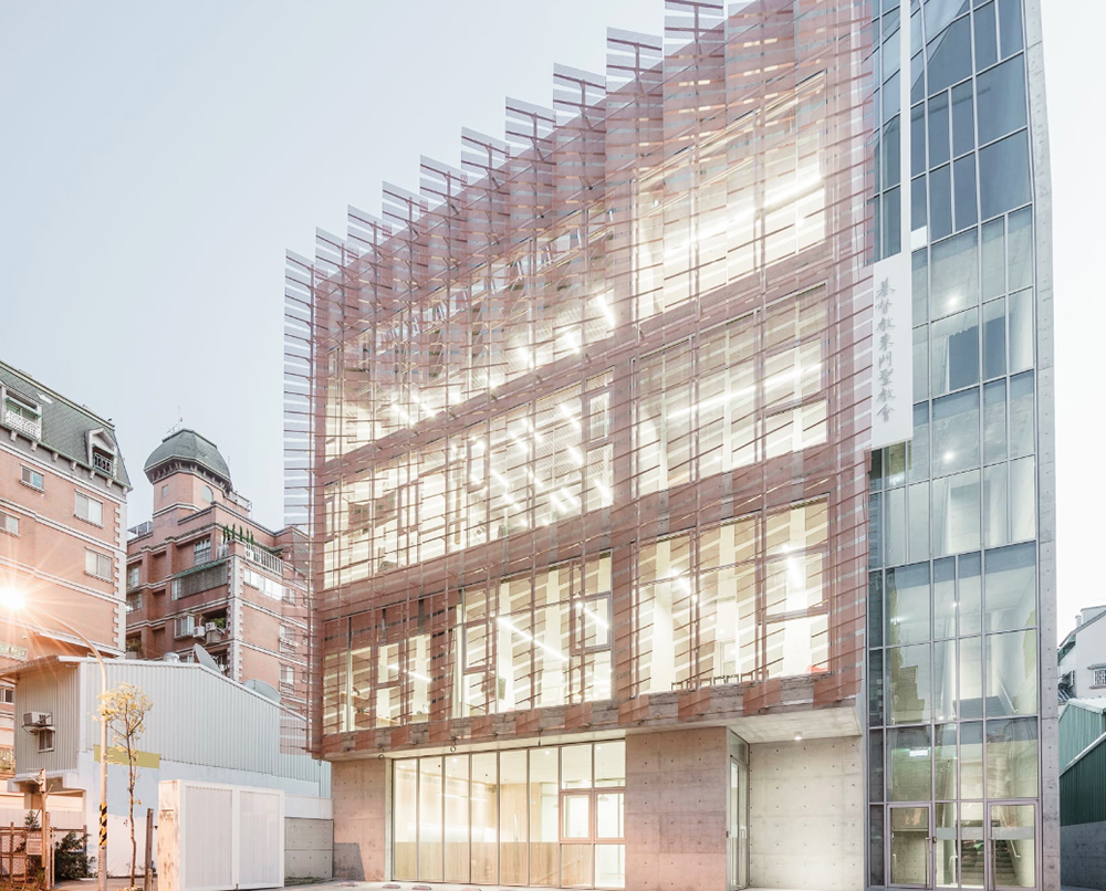 MAYU architects+ adds copper-coloured featherlike screen to main facade of Tung-Men Holiness Church