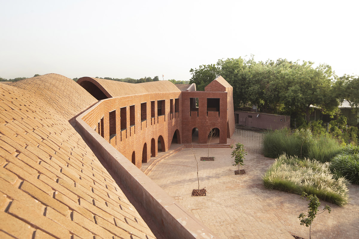 A school built from tilted brick vaults evoke a child's freedom in India