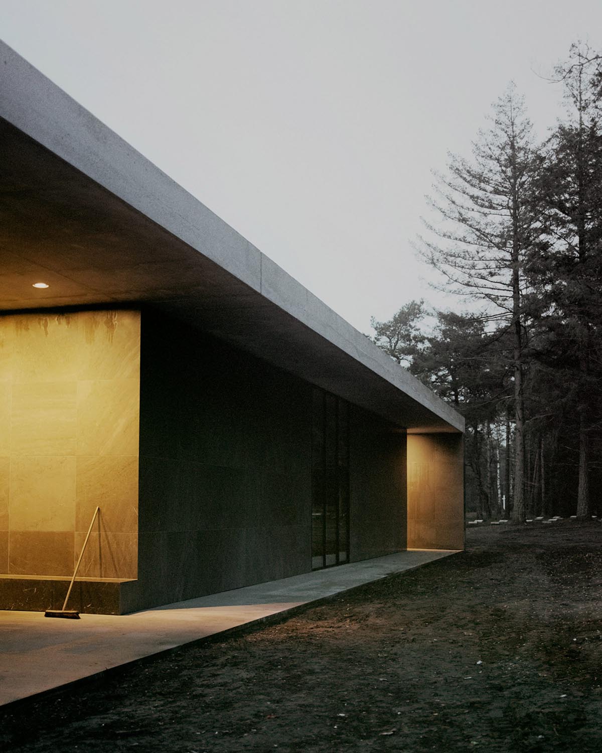 KAAN Architecten built serene Loenen Pavilion commemorating Dutch victims among pine trees