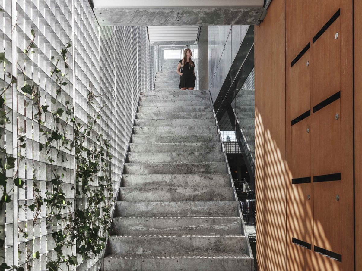 A collage of elements reflecting surroundings assembled on the facade of Office Building by SLETH