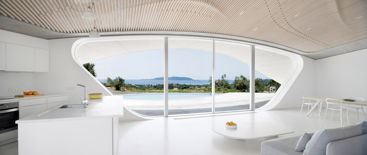 Ypsilon summer house embedded in landscape overlooking Peloponnese’s olive grove