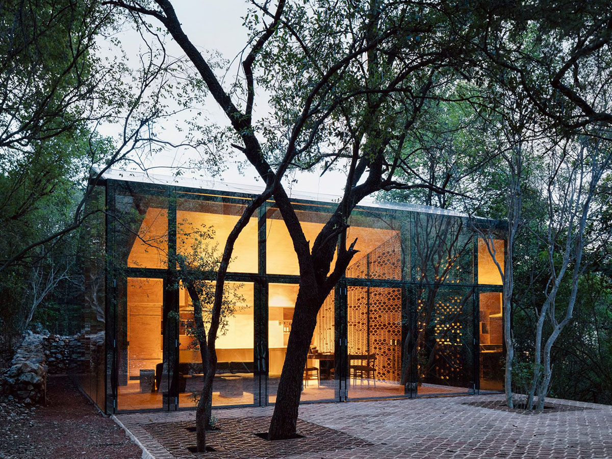 Tatiana Bilbao completes holiday dwelling that reflects its surrounding landscape with mirrored skin