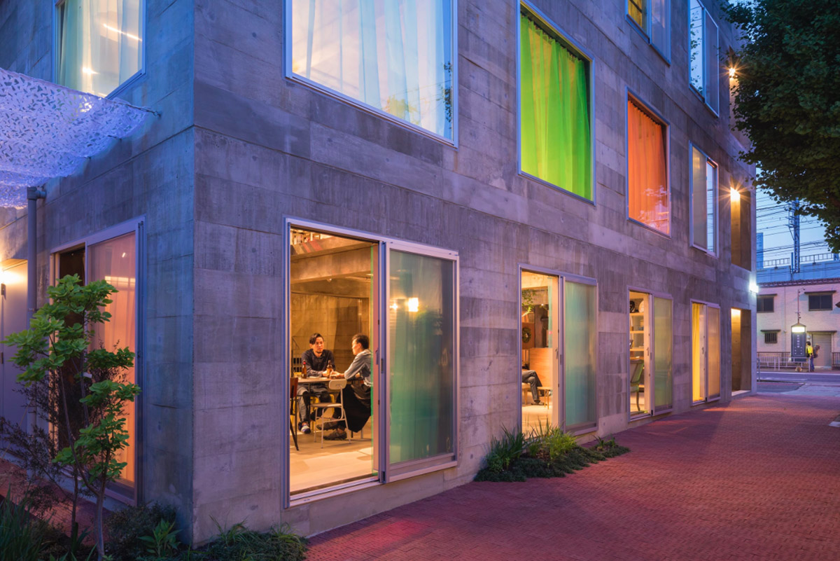Tato Architects creates painted effect to this concrete hotel by using colourful curtains in Osaka