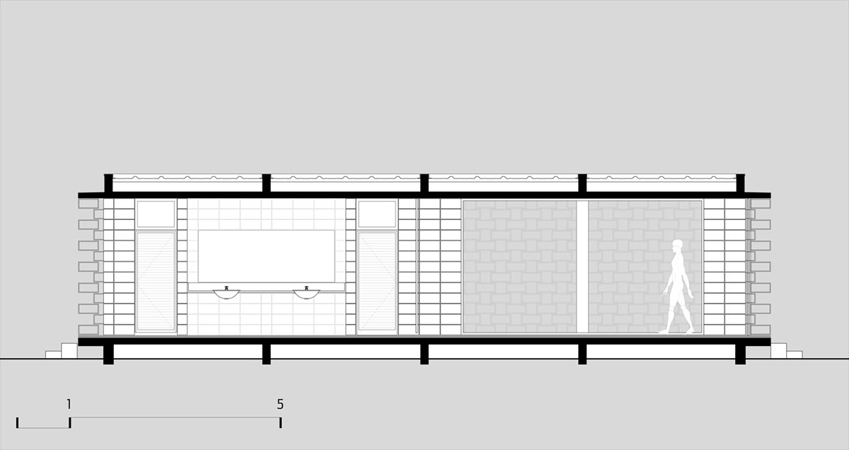 Hollowed-out concrete screens create changing filter for this service building in São Paulo