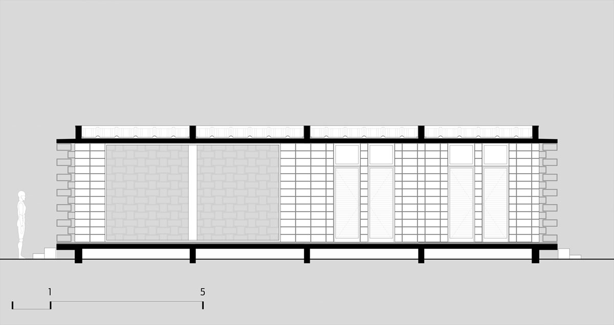 Hollowed-out concrete screens create changing filter for this service building in São Paulo