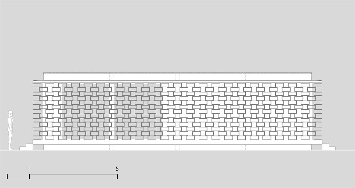 Hollowed-out concrete screens create changing filter for this service building in São Paulo