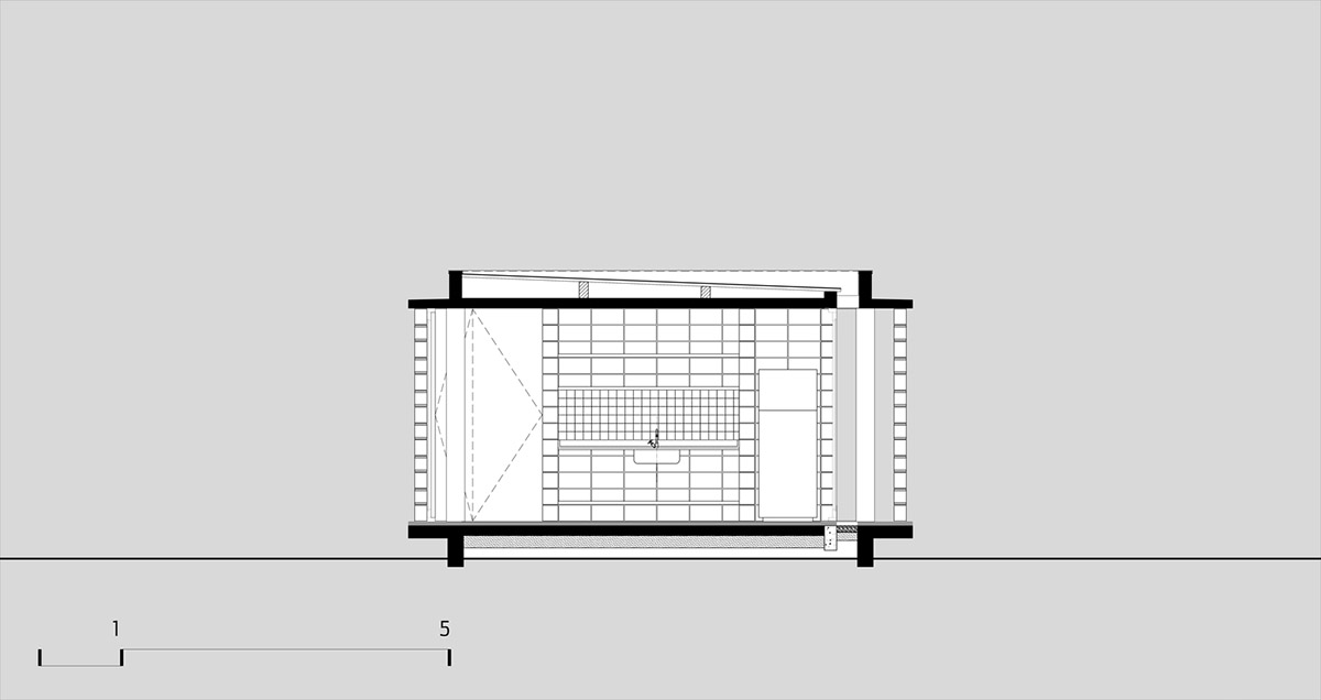 Hollowed-out concrete screens create changing filter for this service building in São Paulo