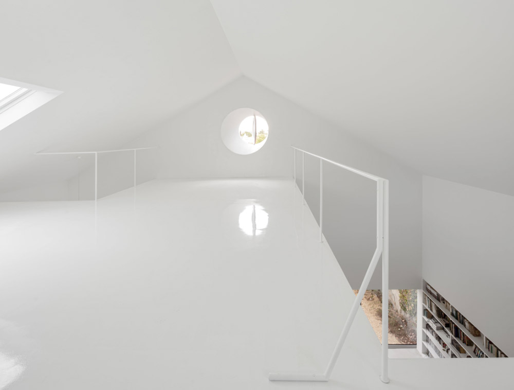 Extrastudio converted former winery in Portugal  into a new family home with red mortar walls