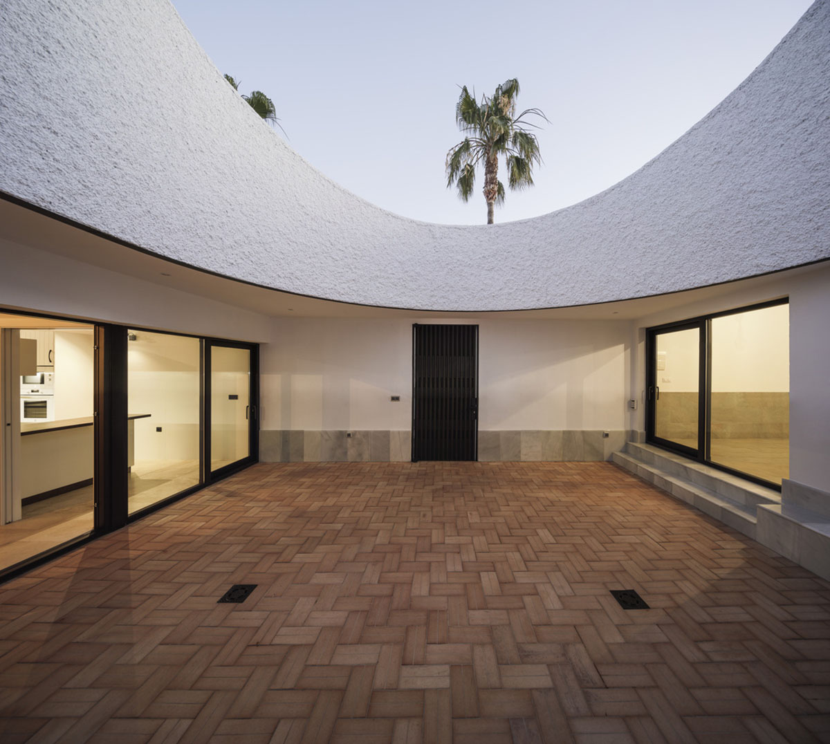 Studio Wet creates single linear space for a fortress-like family house in small village of Spain