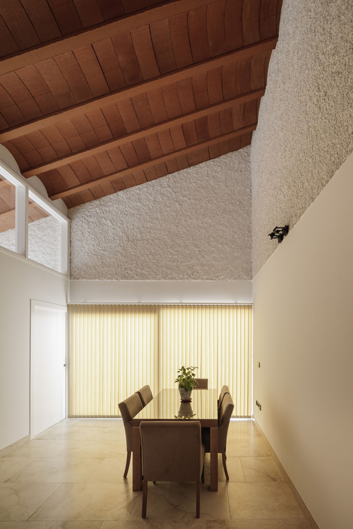 Studio Wet creates single linear space for a fortress-like family house in small village of Spain