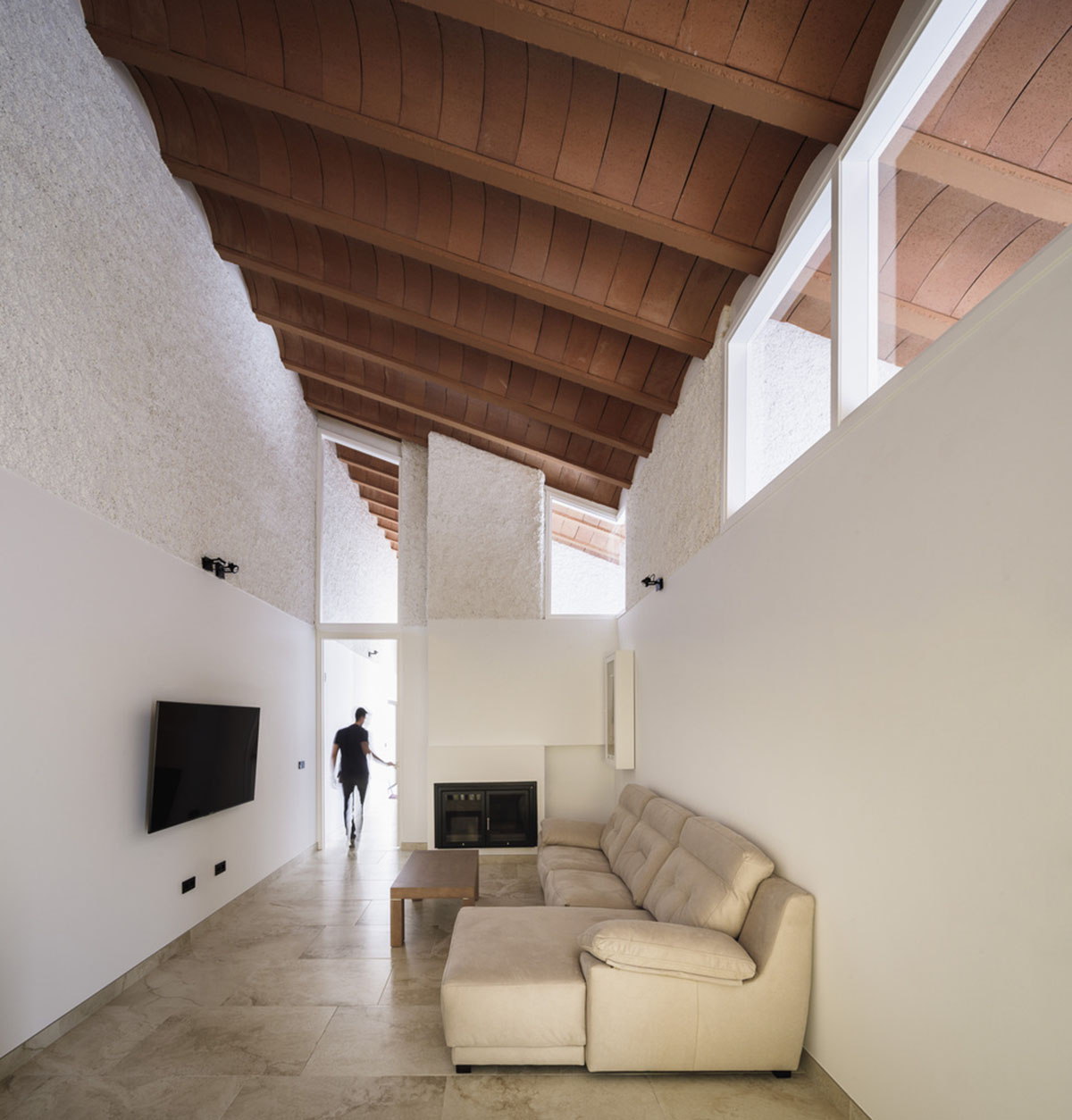 Studio Wet creates single linear space for a fortress-like family house in small village of Spain