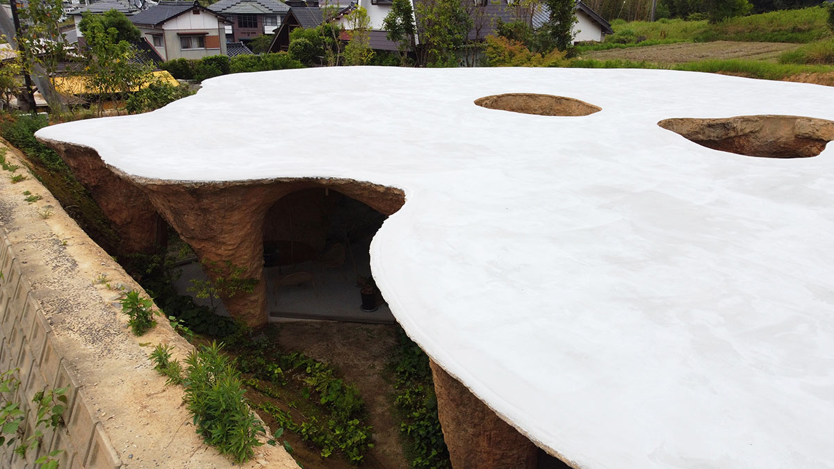 Junya.Ishigami+Associates reveals cave-like house and restaurant in earth form in Japan 