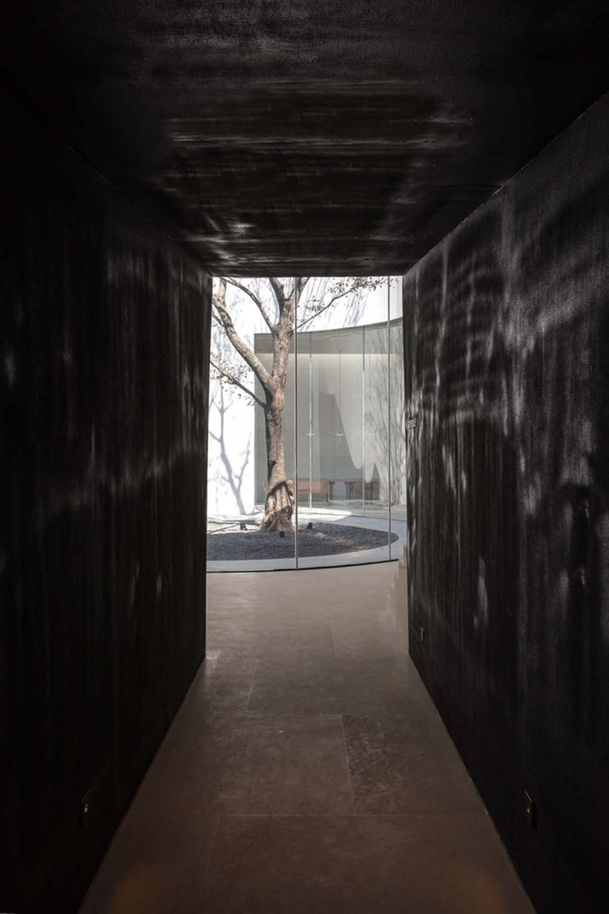 Waterfrom Design creates peaceful interior with wooden furnitures for tea community center in China