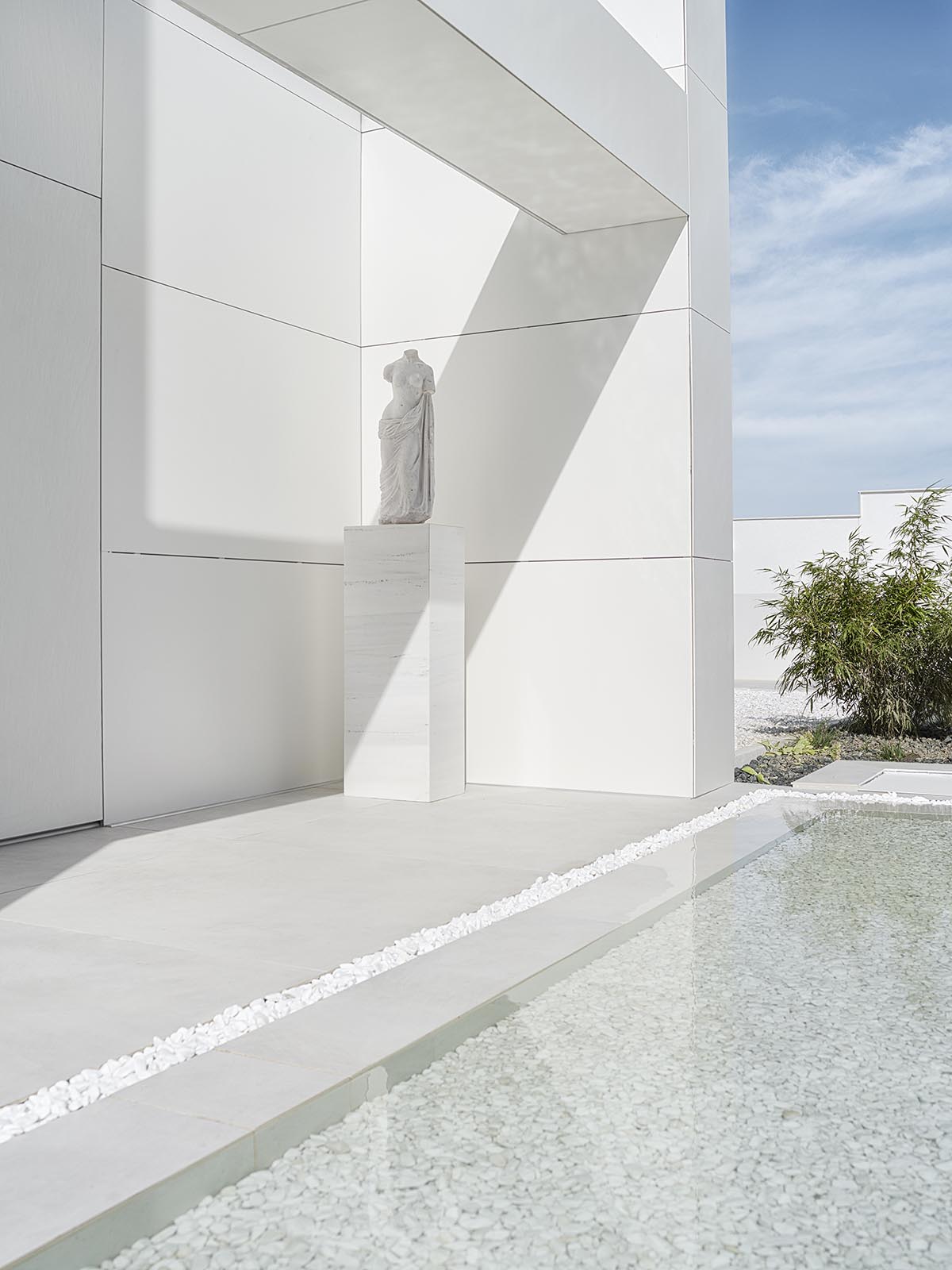 Simple Architecture renovates old house with gridded fa&ccedil;ade in Bulgaria