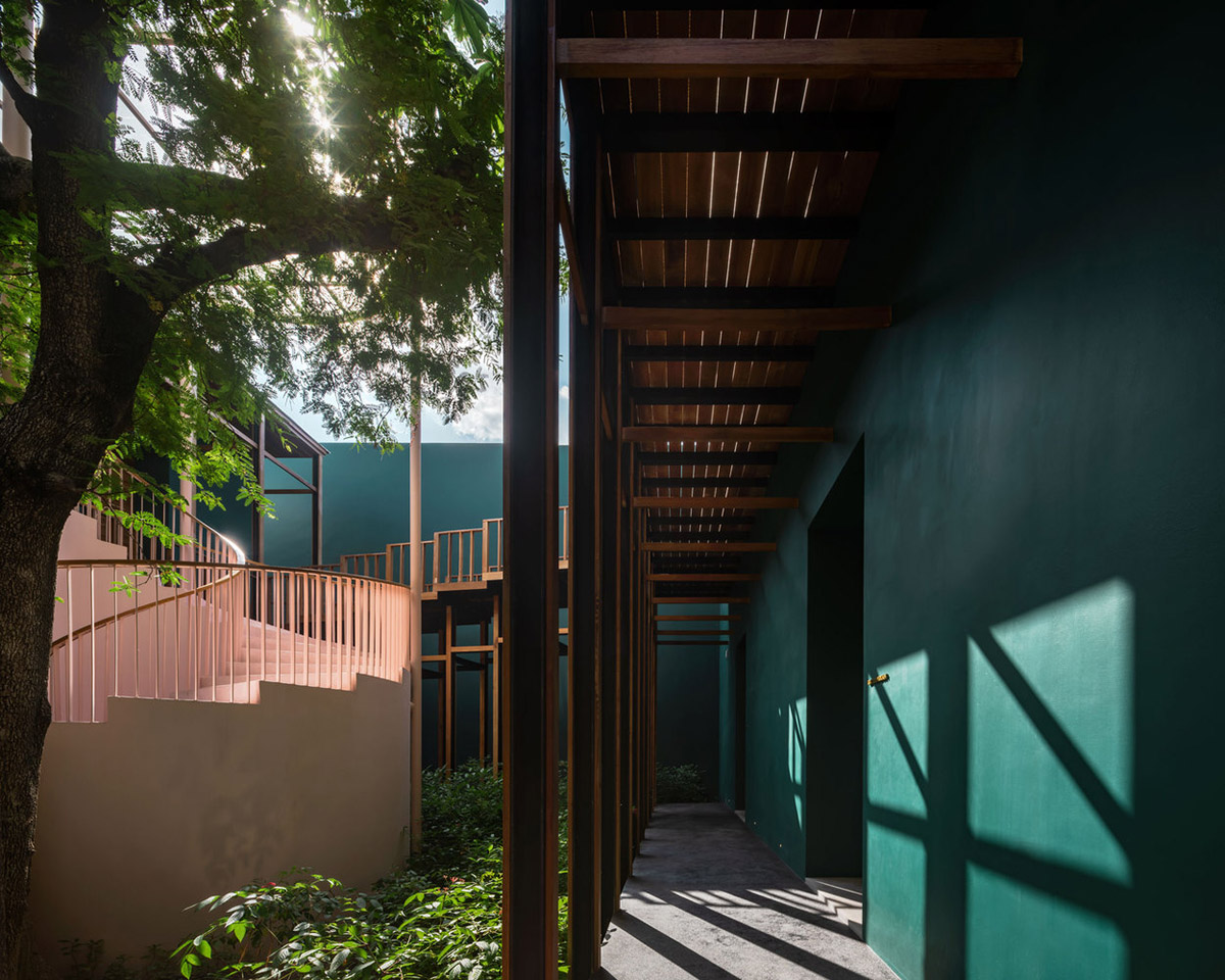 onion combines white concave and convex walls with colorful surfaces for beach resort in Thailand