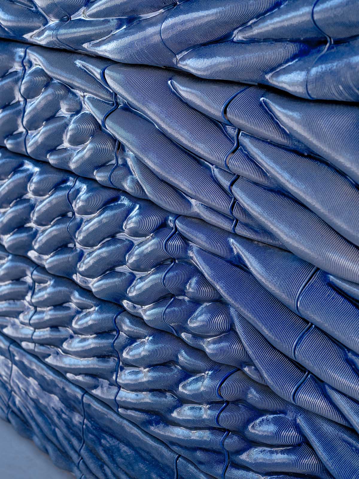 Studio RAP clads two gates of PoortMeesters residential building block in 3D blue porcelain