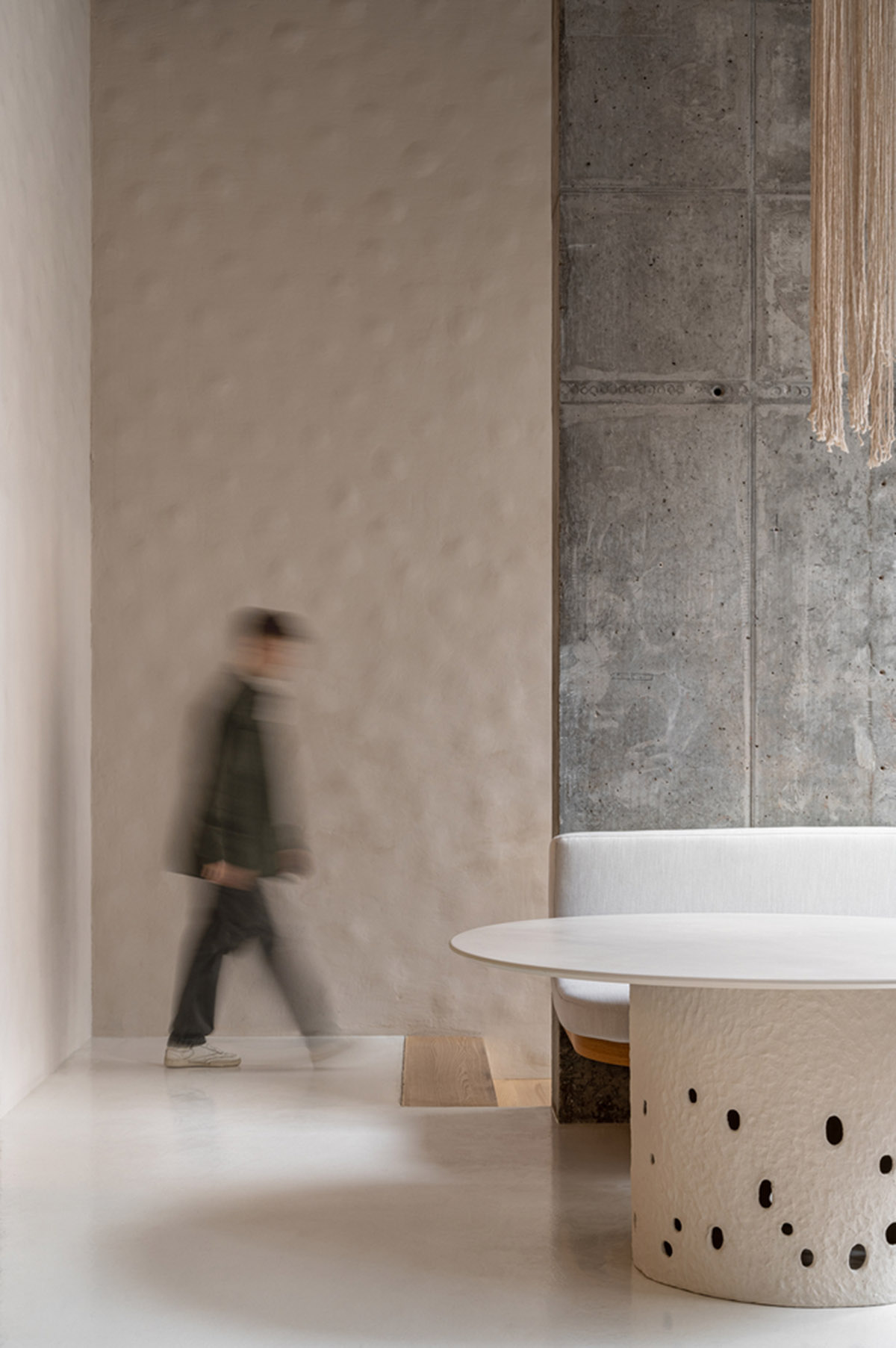 Earth-toned materials and soft lines form interiors of this ready-to-eat food restaurant in Kyiv
