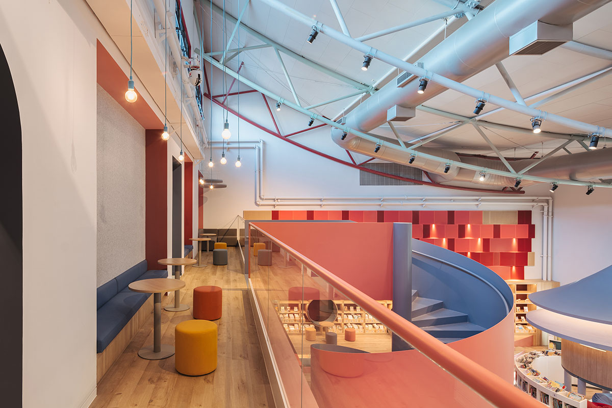 Elementary school library features vibrant colors and playful elements, resembling a fairy tale 