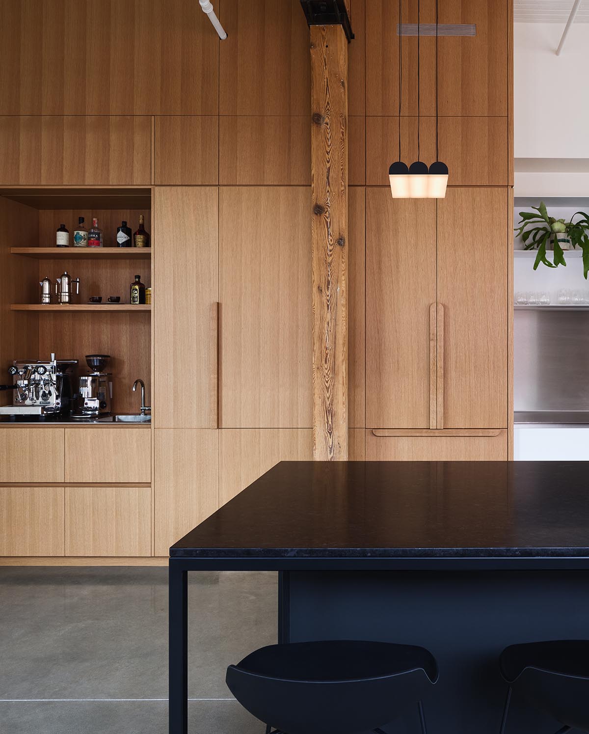 La Firme renovates historic mid-19th-century building with brick walls and oak cabinets in Montreal 