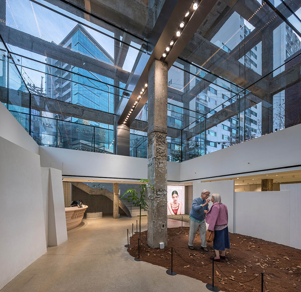 Perfume store by The System Lab shows the beauty of scent with gridded concrete and glass box