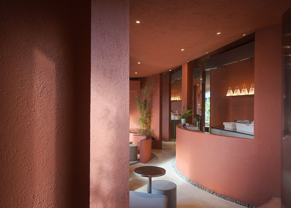 Arti Design Studio creates red arched walls to provide different seating experience in Indonesia 