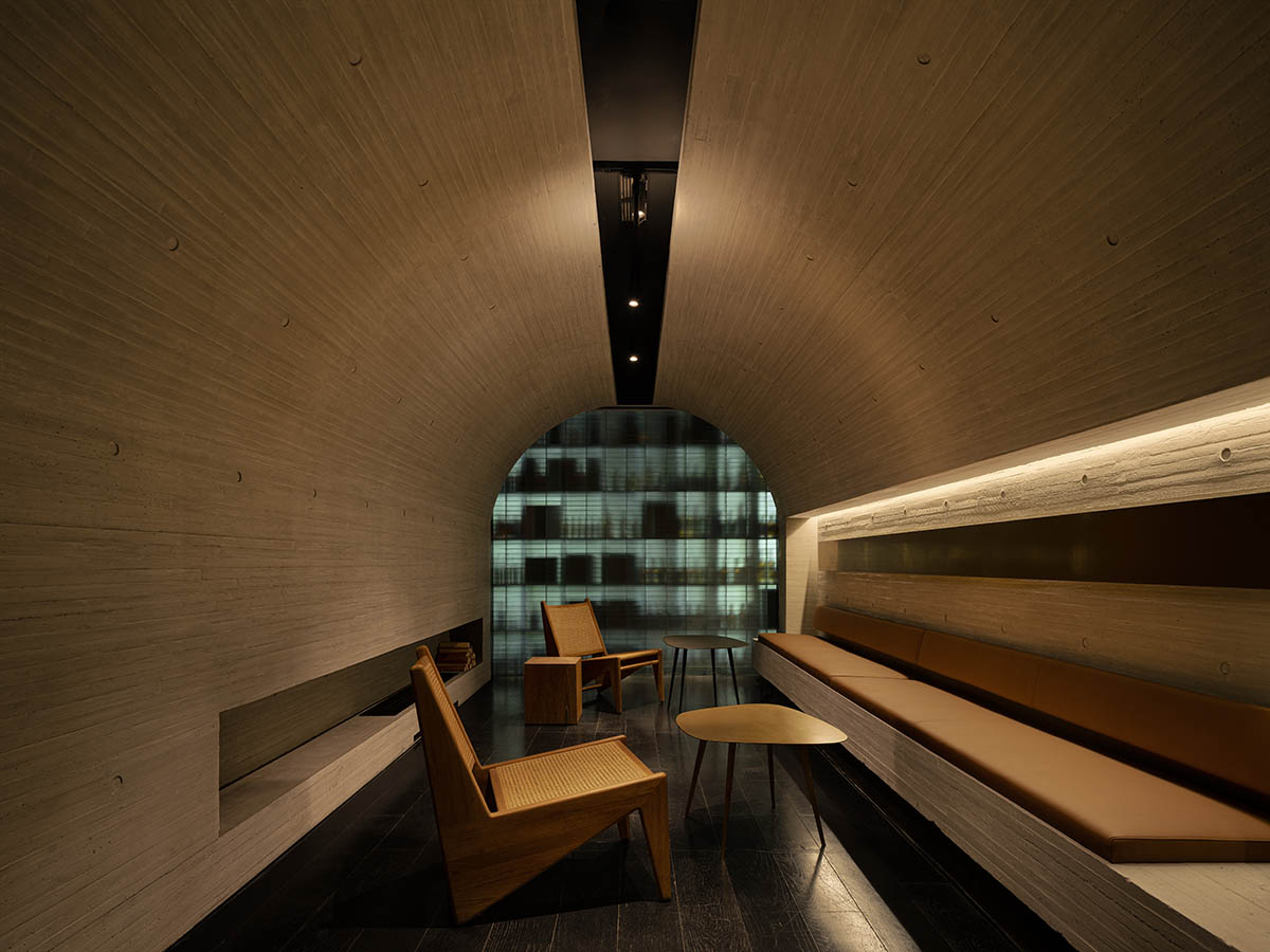 Large triple-arched windows enhance the iconic presence of the concrete Whisky Bar in Taiyuan, China