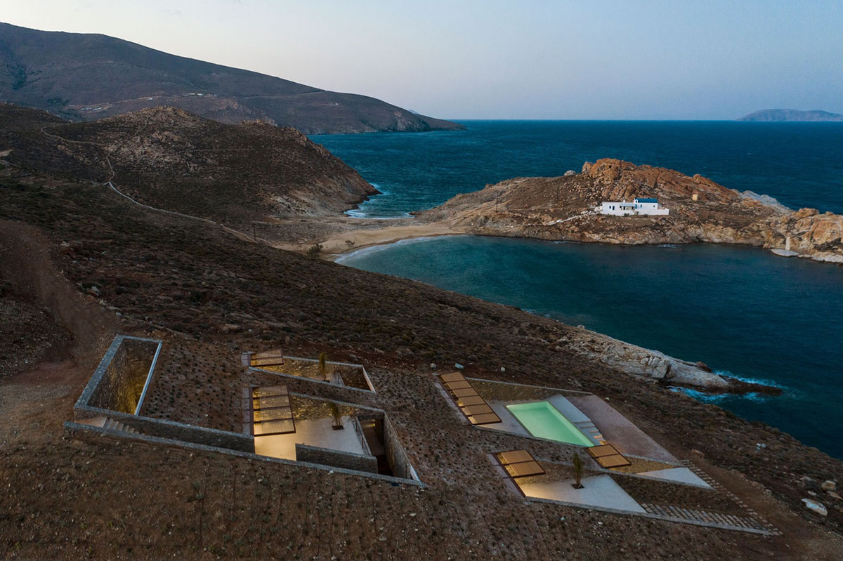 MOLD Architects used advantages of sloping land to design Ncaved house in Greece