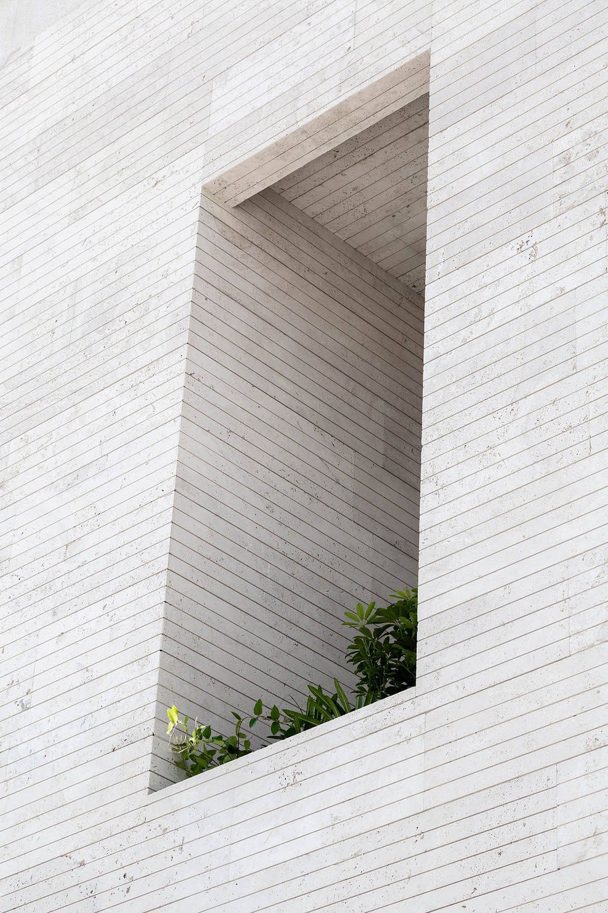 CAAT Studio creates spatial variations of stone on the facade of this Iranian residential building