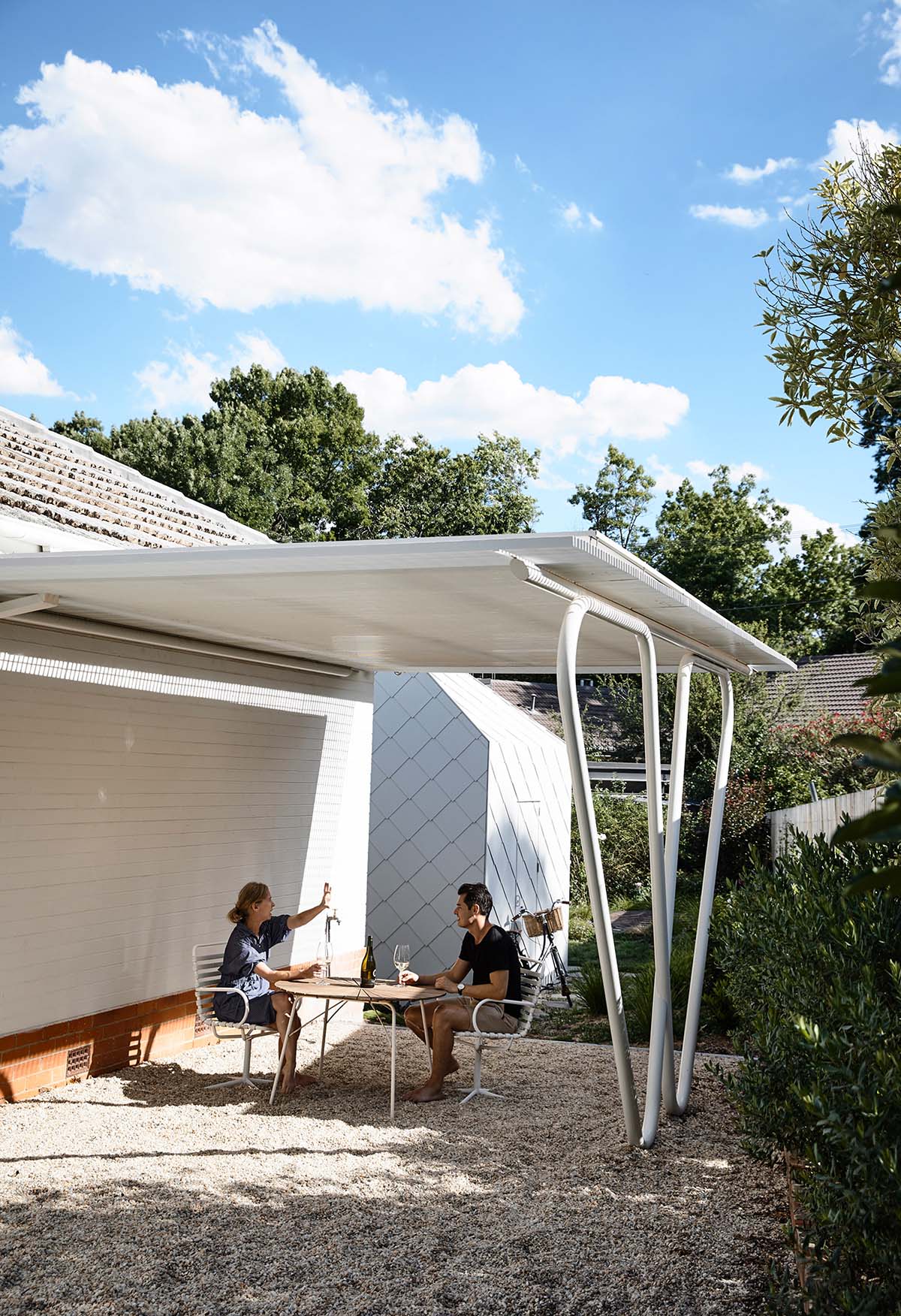 Austin Maynard Architects extends existing post-war Canberra house with two shingle-clad pavilions
